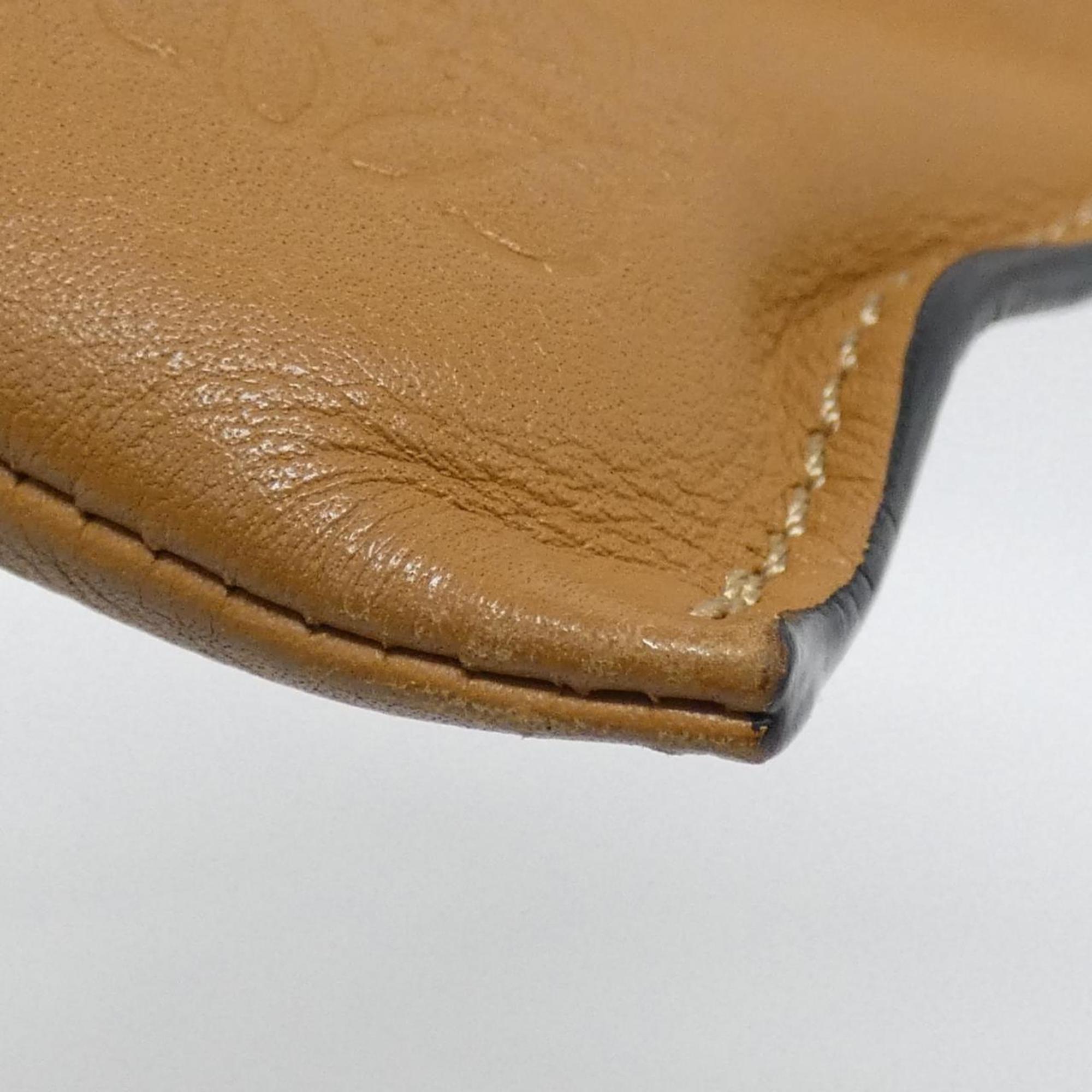 Flamenco Knot Clutch Leather Mini