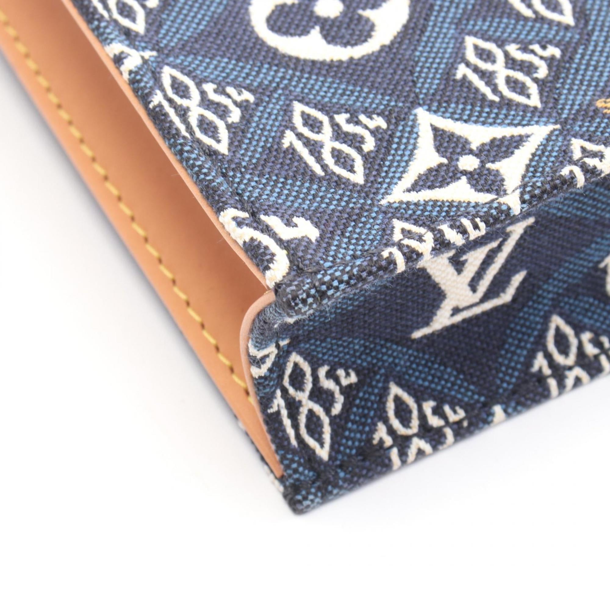Louis Vuitton Brown Navy White Canvas Leather Handbag (Pre-Owned)