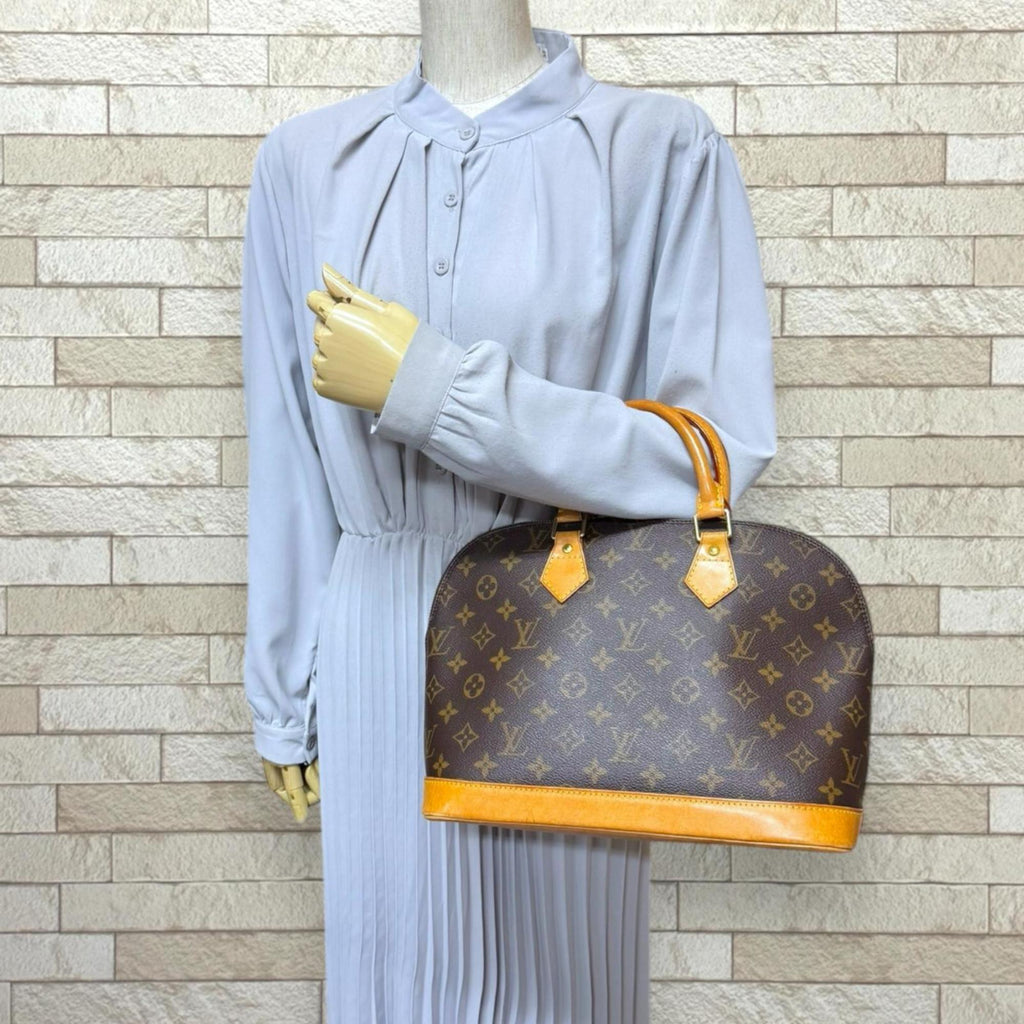 Louis Vuitton Brown Monogram Canvas Handbag (Pre-Owned)