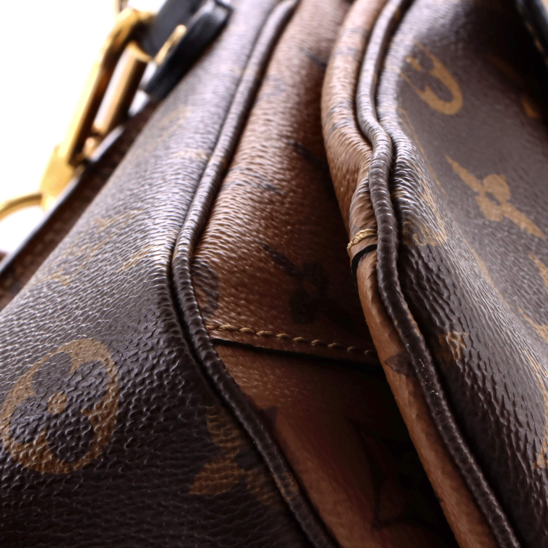 Pochette Metis Reverse Monogram Canvas