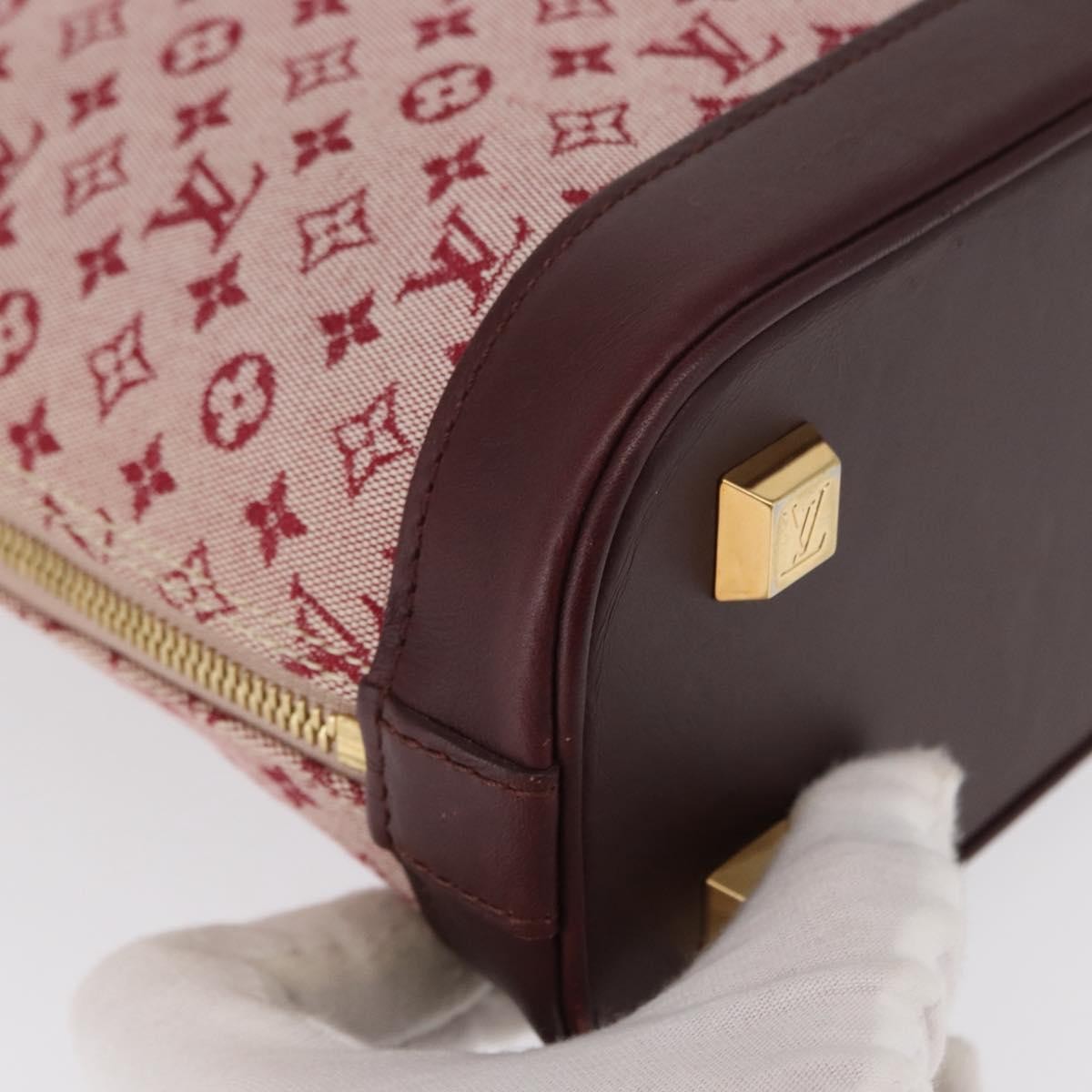 Louis Vuitton Alma Handbag Mini Lin Monogram Red Canvas Handbag (Pre-Owned)