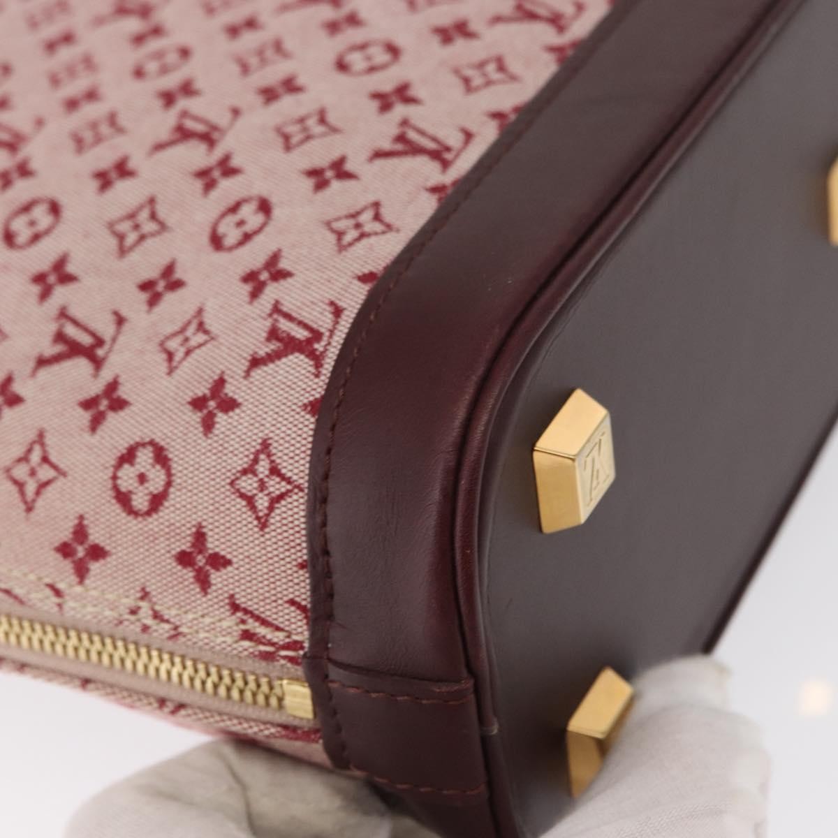 Louis Vuitton Alma Handbag Mini Lin Monogram Red Canvas Handbag (Pre-Owned)