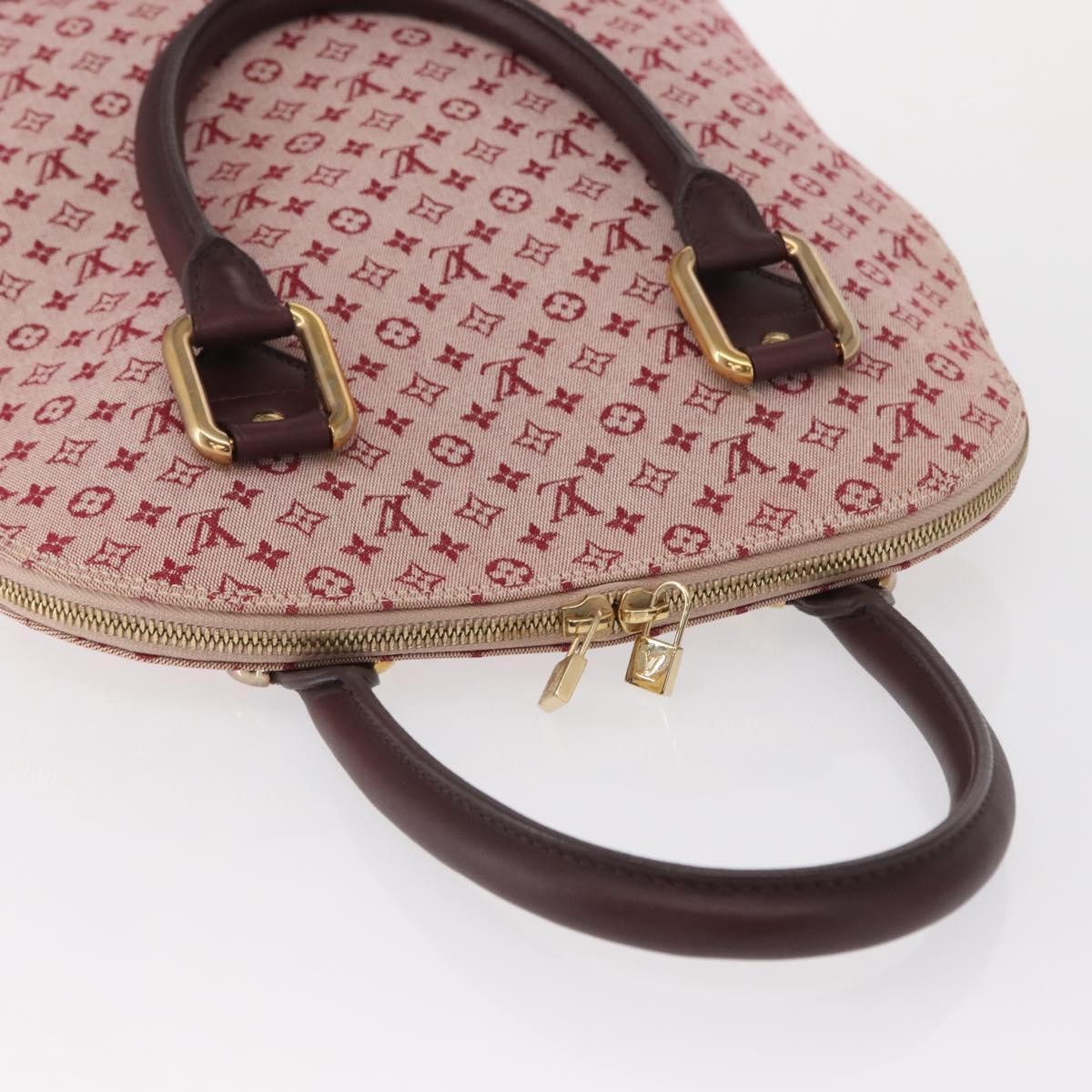 Louis Vuitton Alma Handbag Mini Lin Monogram Red Canvas Handbag (Pre-Owned)