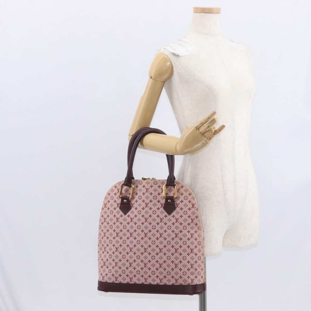 Louis Vuitton Alma Handbag Mini Lin Monogram Red Canvas Handbag (Pre-Owned)